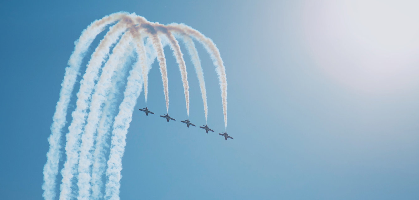 five aerial planes flying